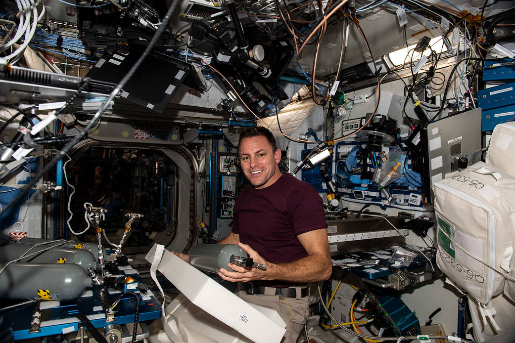 NASA astronaut Josh Cassada replaces carbon dioxide bottles