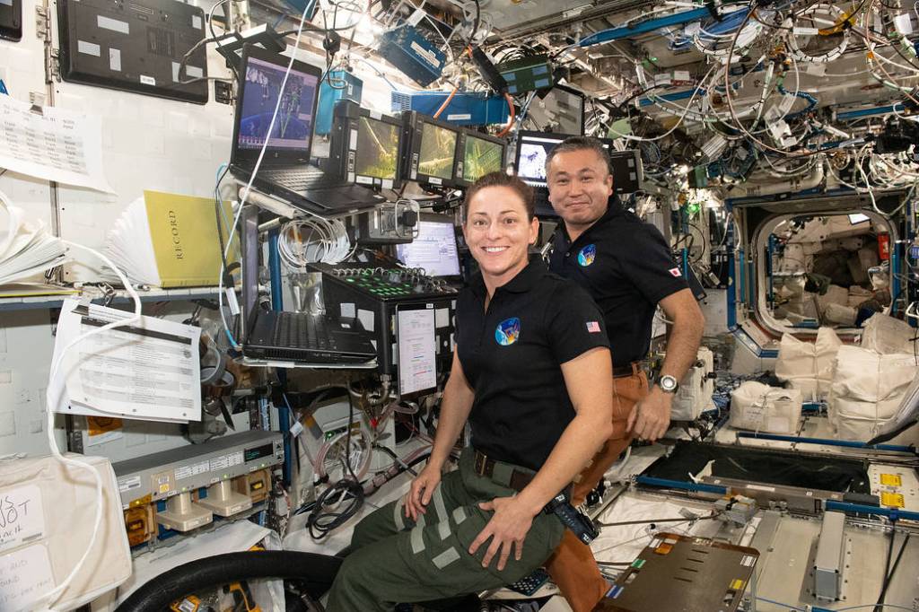 Astronaut Nicole Mann and Koichi Wakata at the robotics workstation