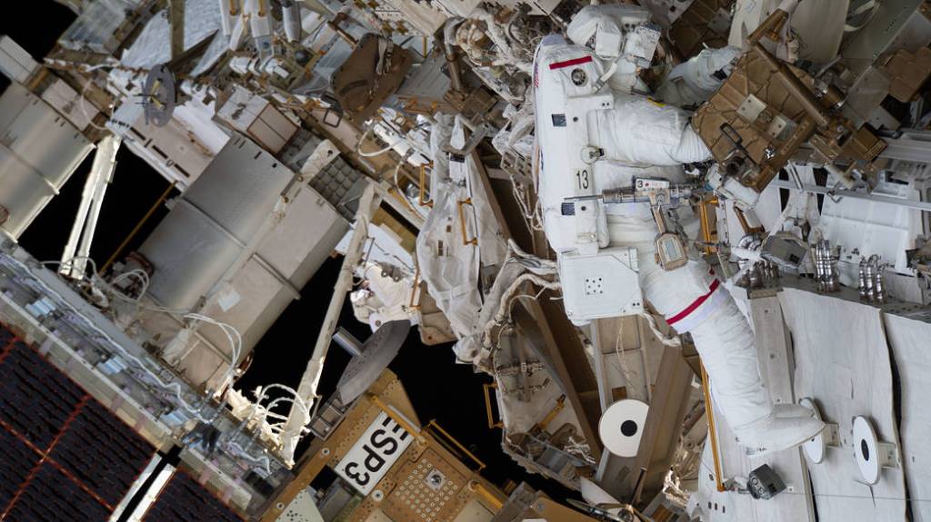 Astronaut Josh Cassada is tethered to the station during a spacewalk