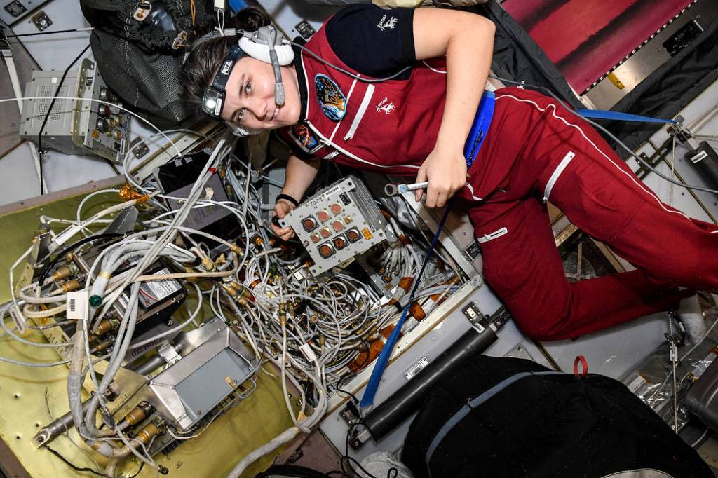 Cosmonauts Anna Kikina works on electronics hardware