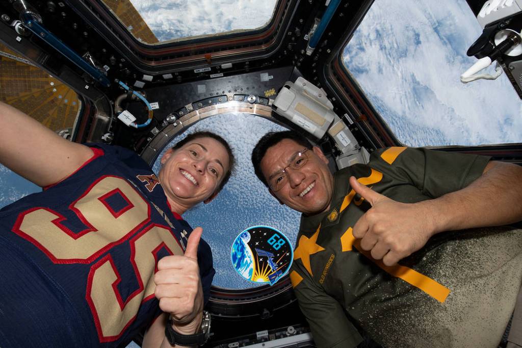 Astronauts Nicole Mann and Frank Rubio in the cupola
