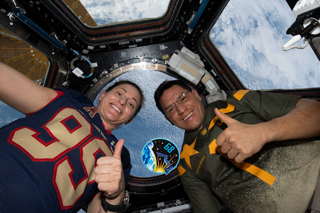 Astronauts Nicole Mann and Frank Rubio in the cupola