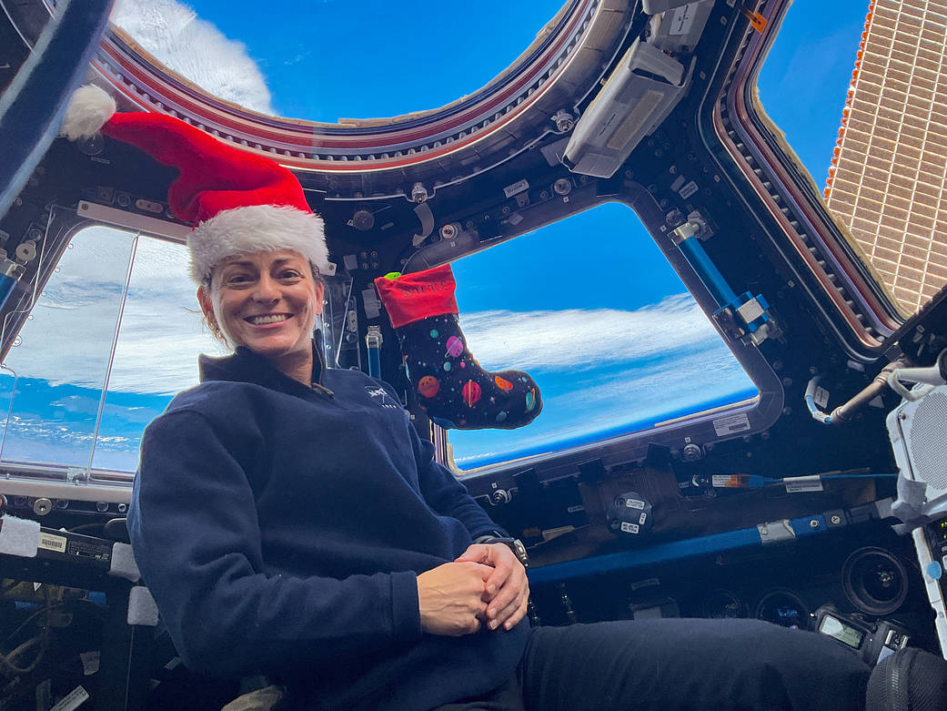 Astronaut Nicole Mann poses for a festive portrait on Christmas Eve