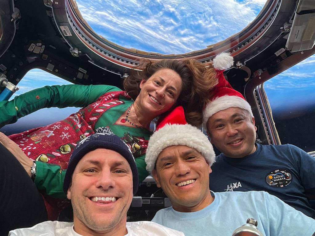 Expedition 68 Flight Engineers pose for a festive portrait on Christmas Day