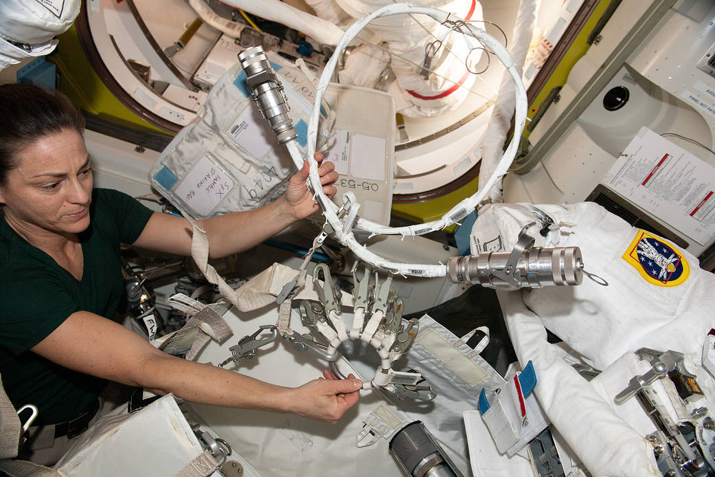 Astronaut Nicole Mann configures spacewalk tools and hardware
