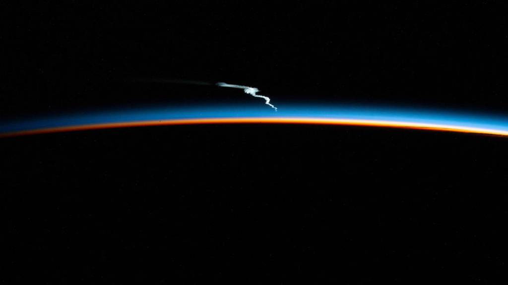 Launch plume of the SpaceX Falcon Heavy rocket seen from the station