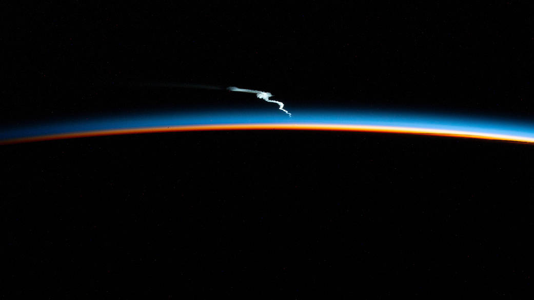Launch plume of the SpaceX Falcon Heavy rocket seen from the station