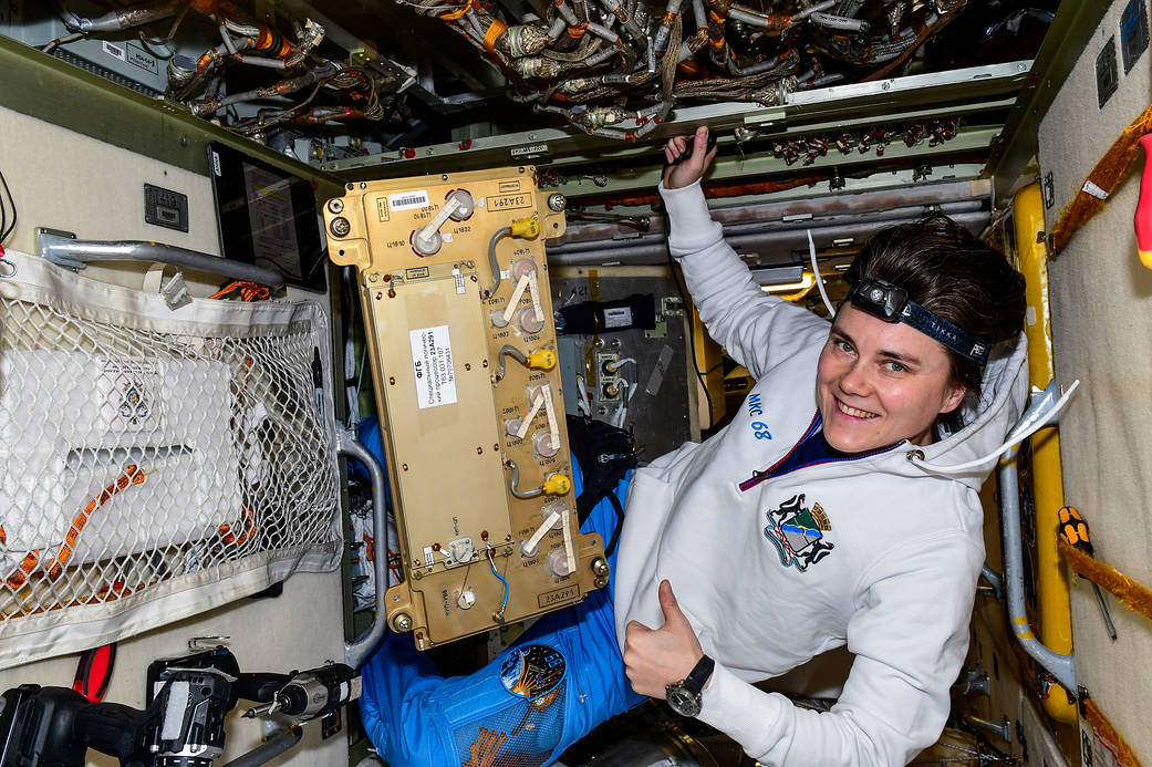 Cosmonaut Anna Kikina works on electronics hardware maintenance