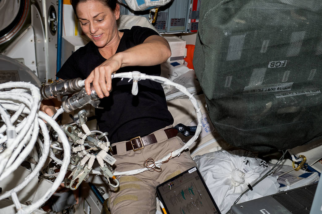 Astronaut Nicole Mann configures spacewalking hardware