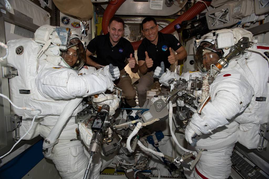 Expedition 68 crew members after a spacewalk