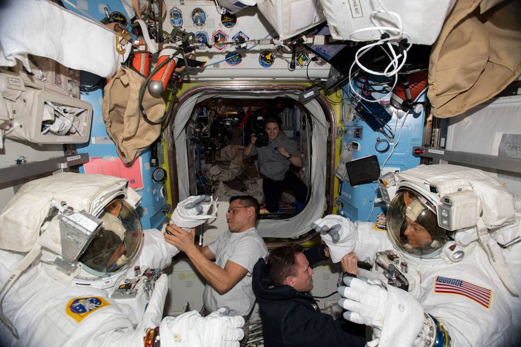 Expedition 68 crew members after a spacewalk