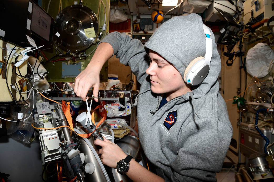 Cosmonaut Anna Kikina works on orbital plumbing tasks
