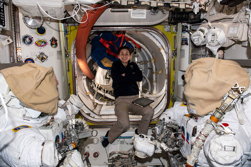 Astronaut Nicole Mann organizes spacewalk tools in the Quest airlock