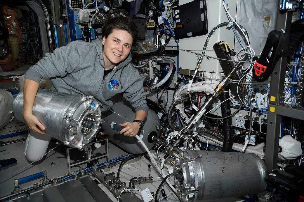 Cosmonaut Anna Kikina works on orbital plumbing tasks
