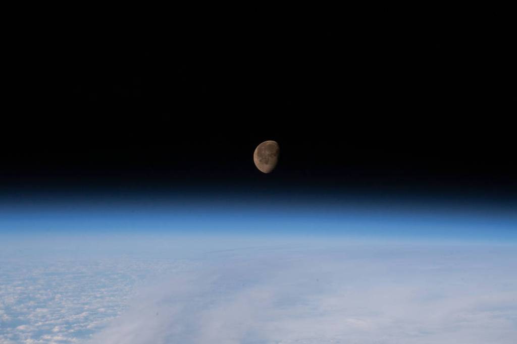 The waning gibbous Moon above Earth’s horizon