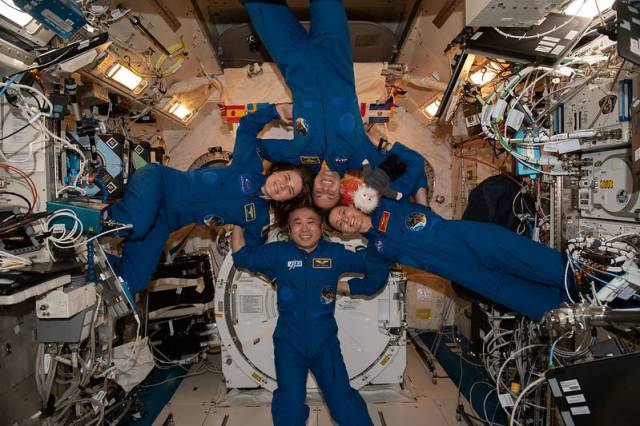 Clockwise from left, Expedition 68 flight engineers Anna Kikina, Josh Cassada, Nicole Mann, and Koichi Wakata pose for a fun portrait aboard the International Space Station. The quartet is planning on returning to Earth this month.