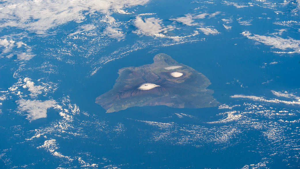 The big island of Hawaii and its two snow-capped volcanos