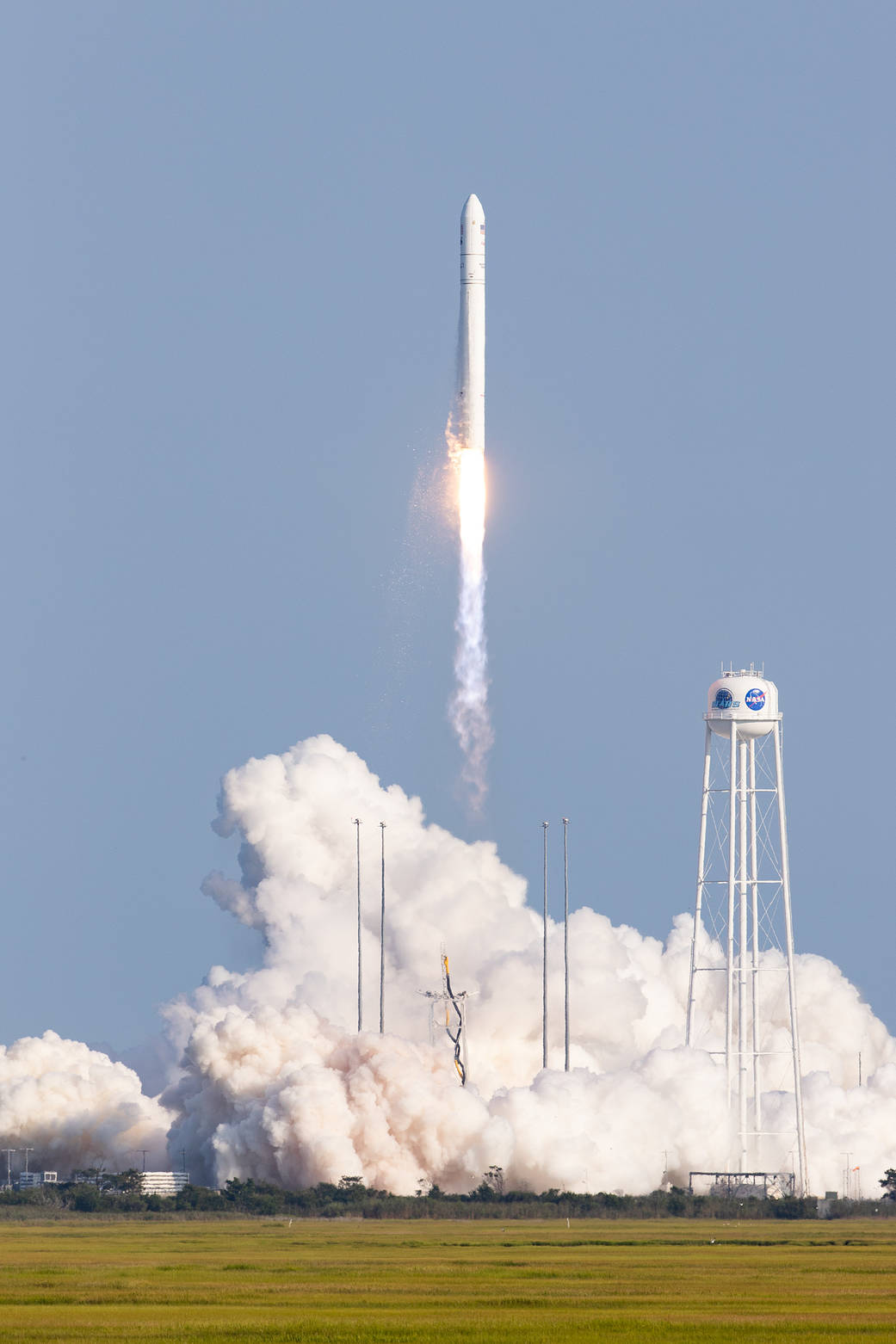 rocket launching against blue background.