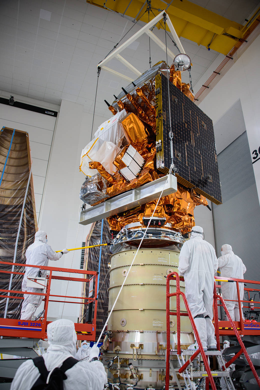 Technicians stack the JPSS-2 satellite atop the LOFTID spacecraft inside the Astrotech Space Operations facility at Vandenberg Space Force Base in ...