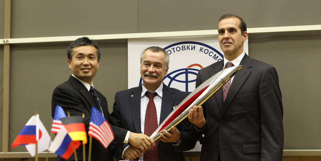 Expedition 38 Crew With Model of Olympic Torch