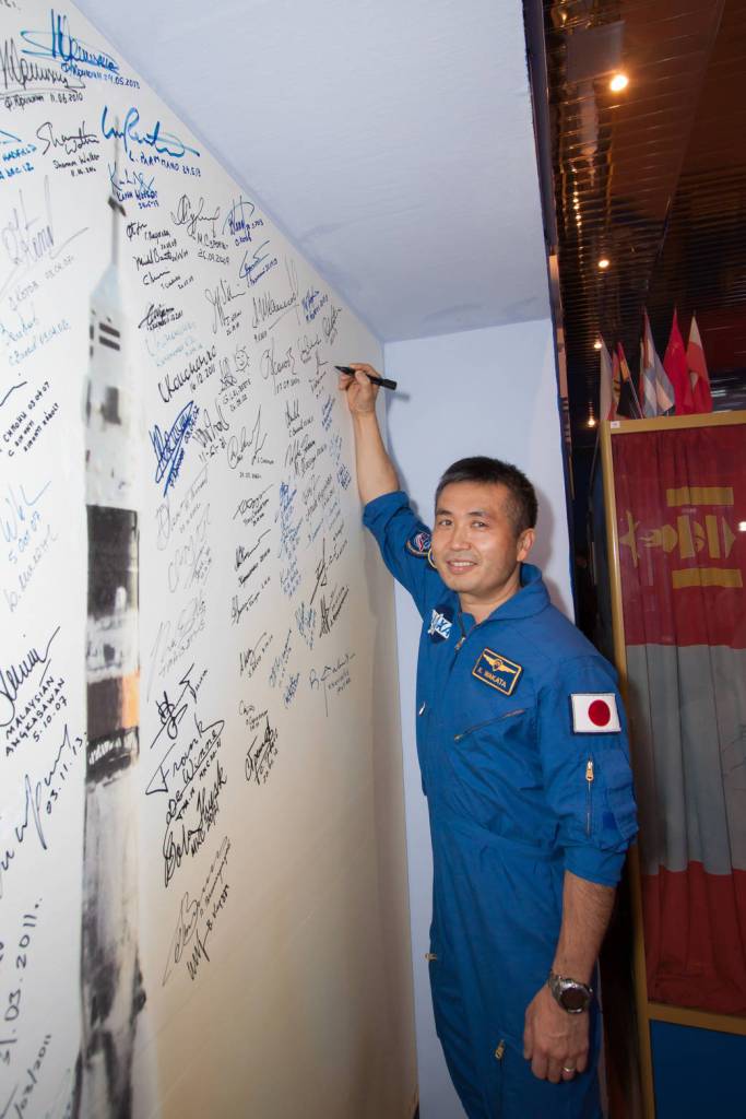 Koichi Wakata signs a wall mural