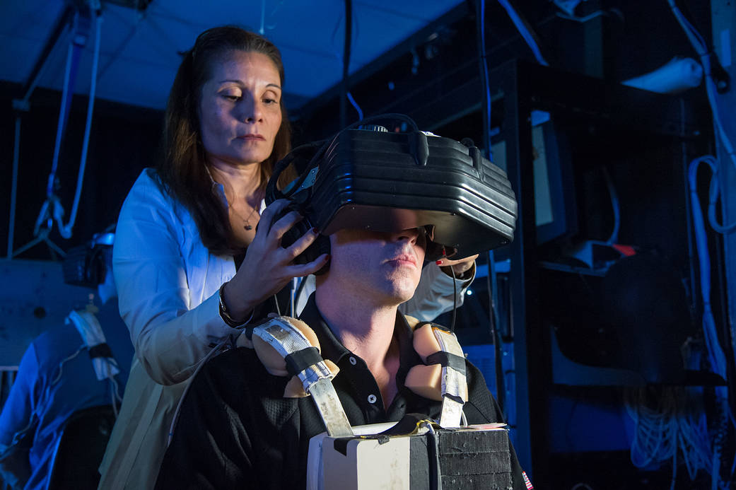 NASA astronaut Reid Wiseman uses virtual reality hardware.