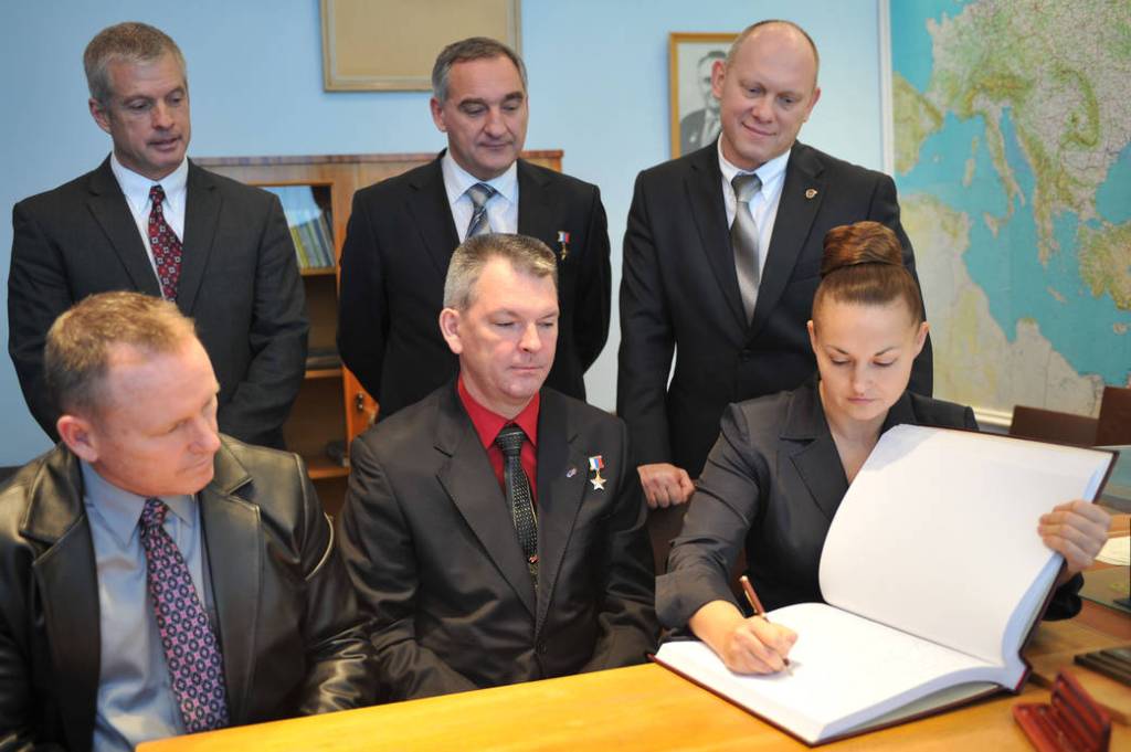 Cosmonaut Elena Serova Signs Commemorative Book