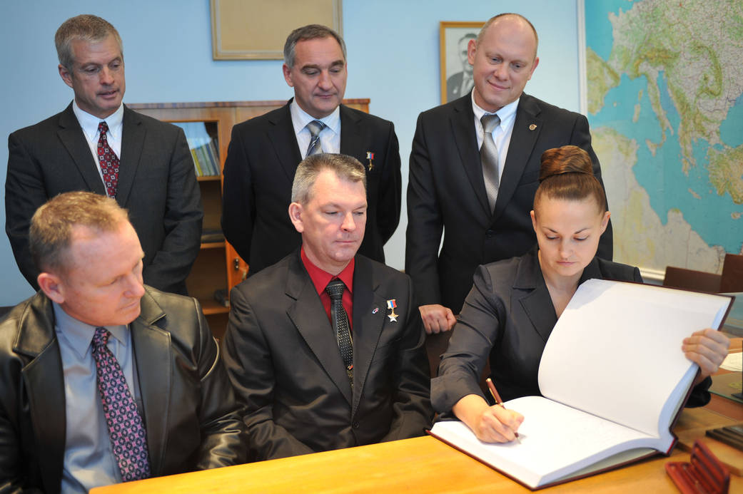 Cosmonaut Elena Serova Signs Commemorative Book