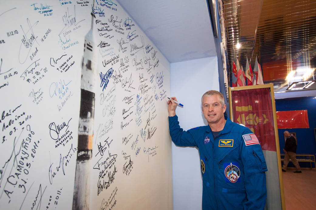 Astronaut Steve Swanson Signs Wall Mural
