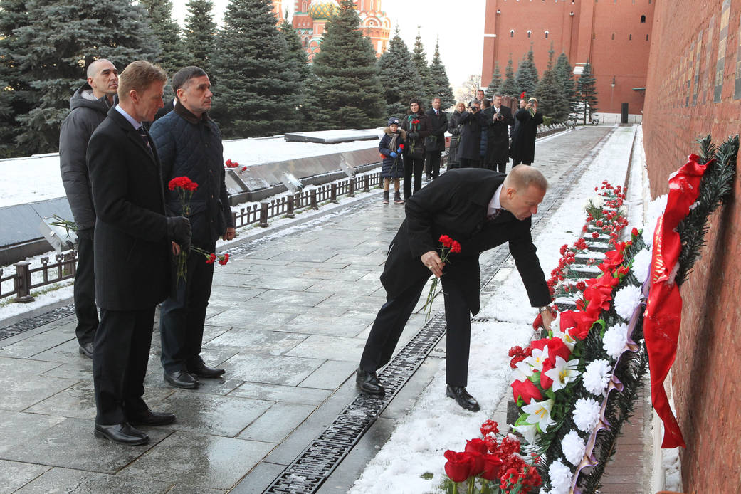 Expedition 46-47 Crew Member Tim Kopra of NASA Lays Flowers