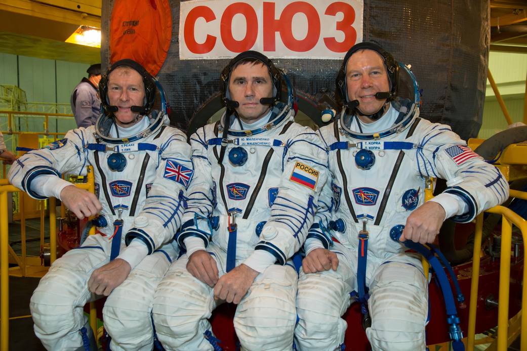 Expedition 46-47 Crew Members in Front of Their Soyuz TMA-19M Spacecraft