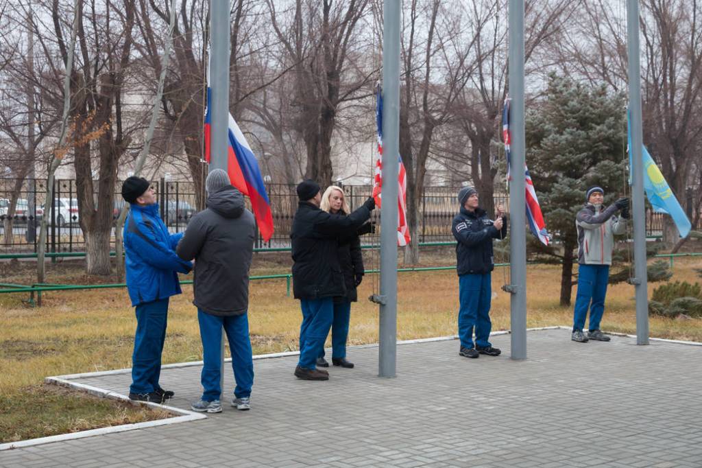Expedition 46-47 Prime and Backup Crew Members Raise Flags