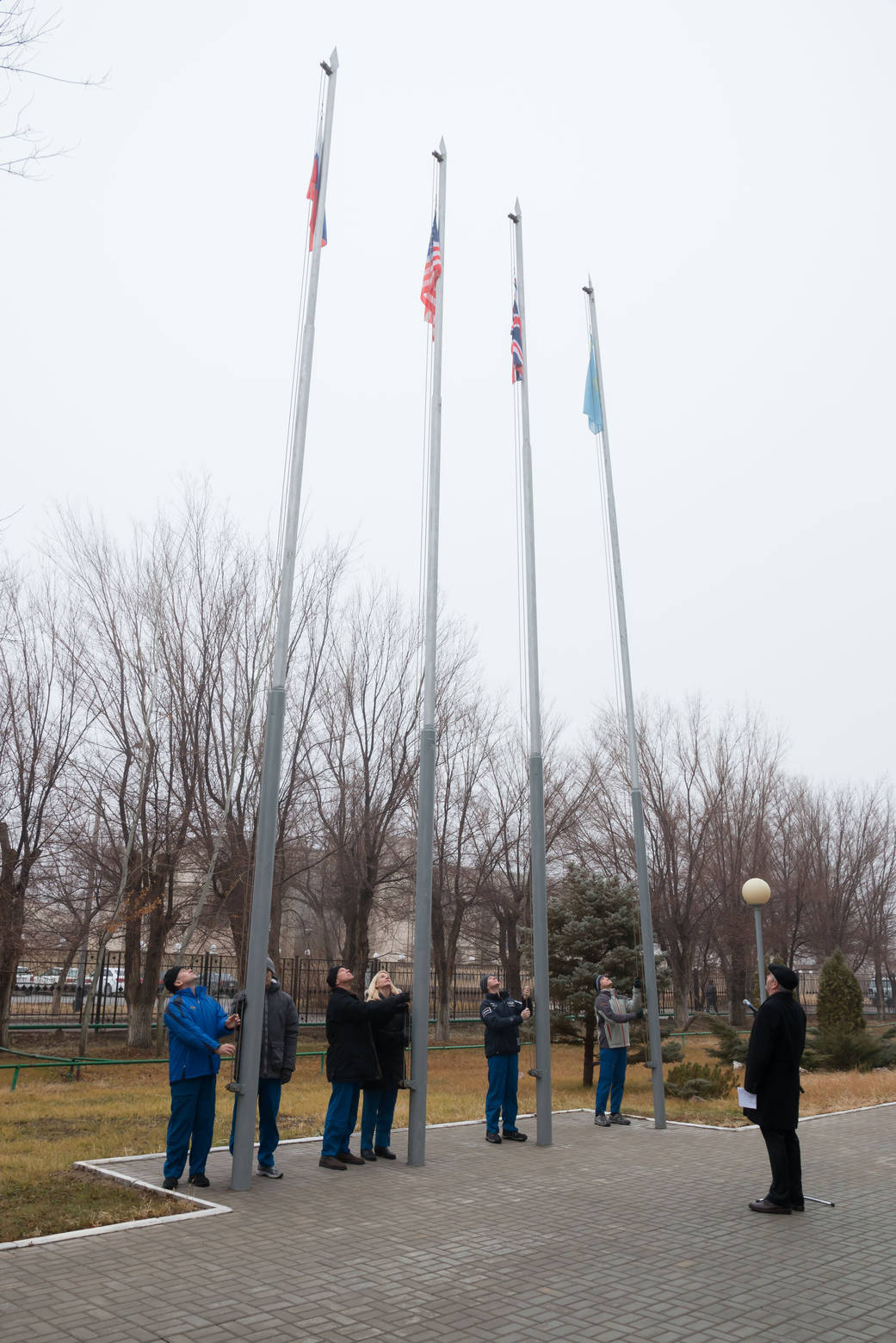 Expedition 46-47 Prime and Backup Crew Members Raise Flags