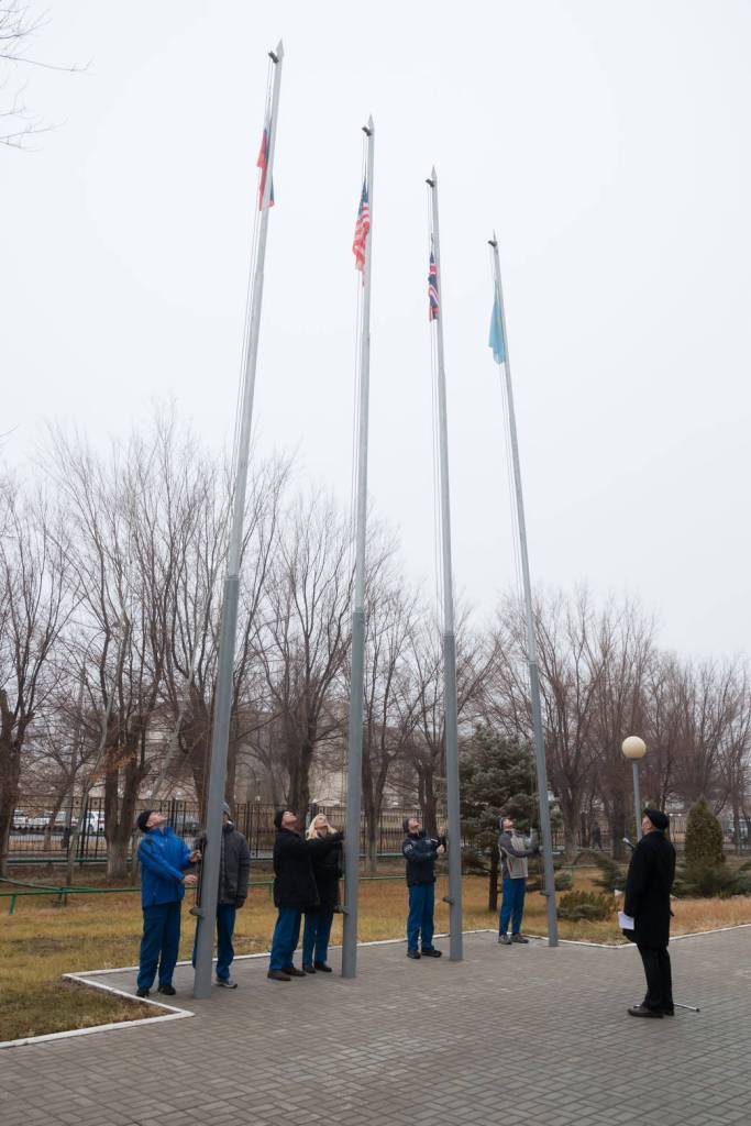 Expedition 46-47 Prime and Backup Crew Members Raise Flags
