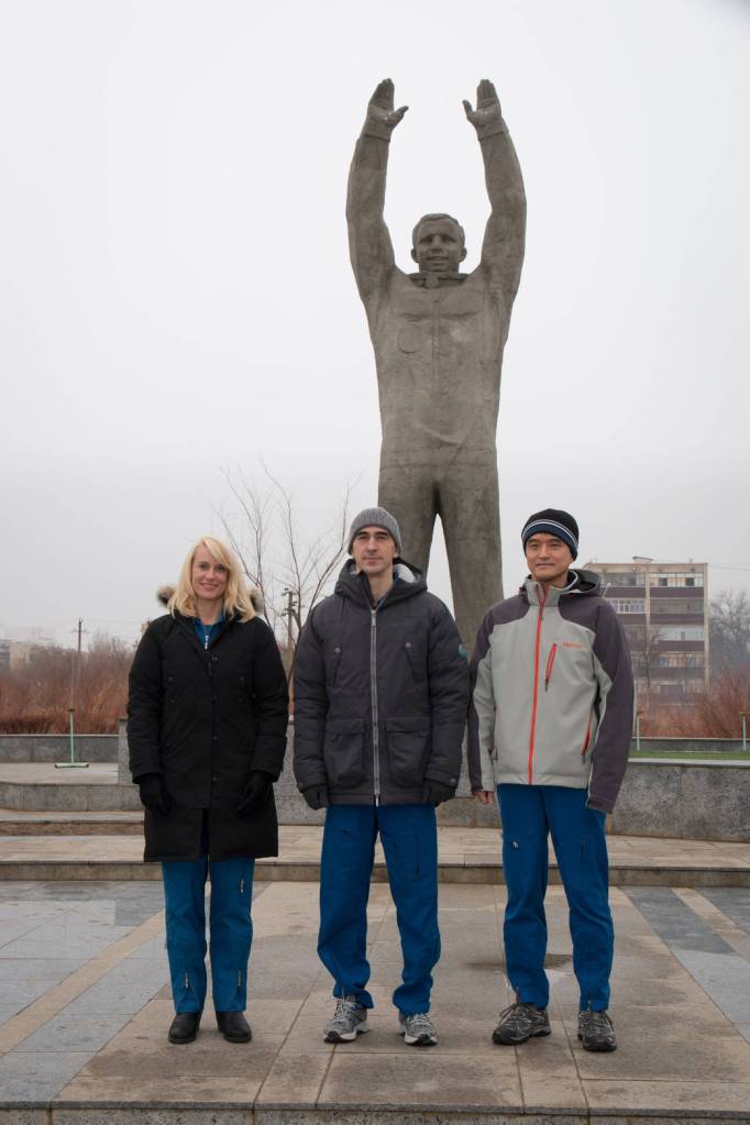 Expedition 46-47 Backup Crew Members in Front of a Statue of Yuri Gagarin