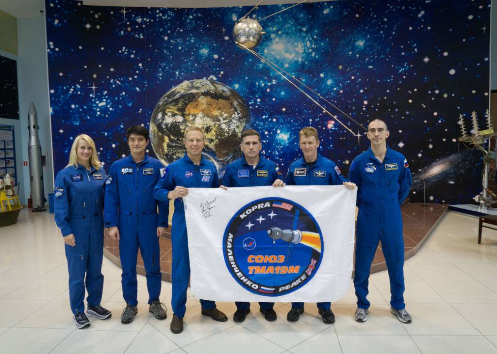 Prime and Backup Expedition 46-47 Crew Members Display Logo Flag