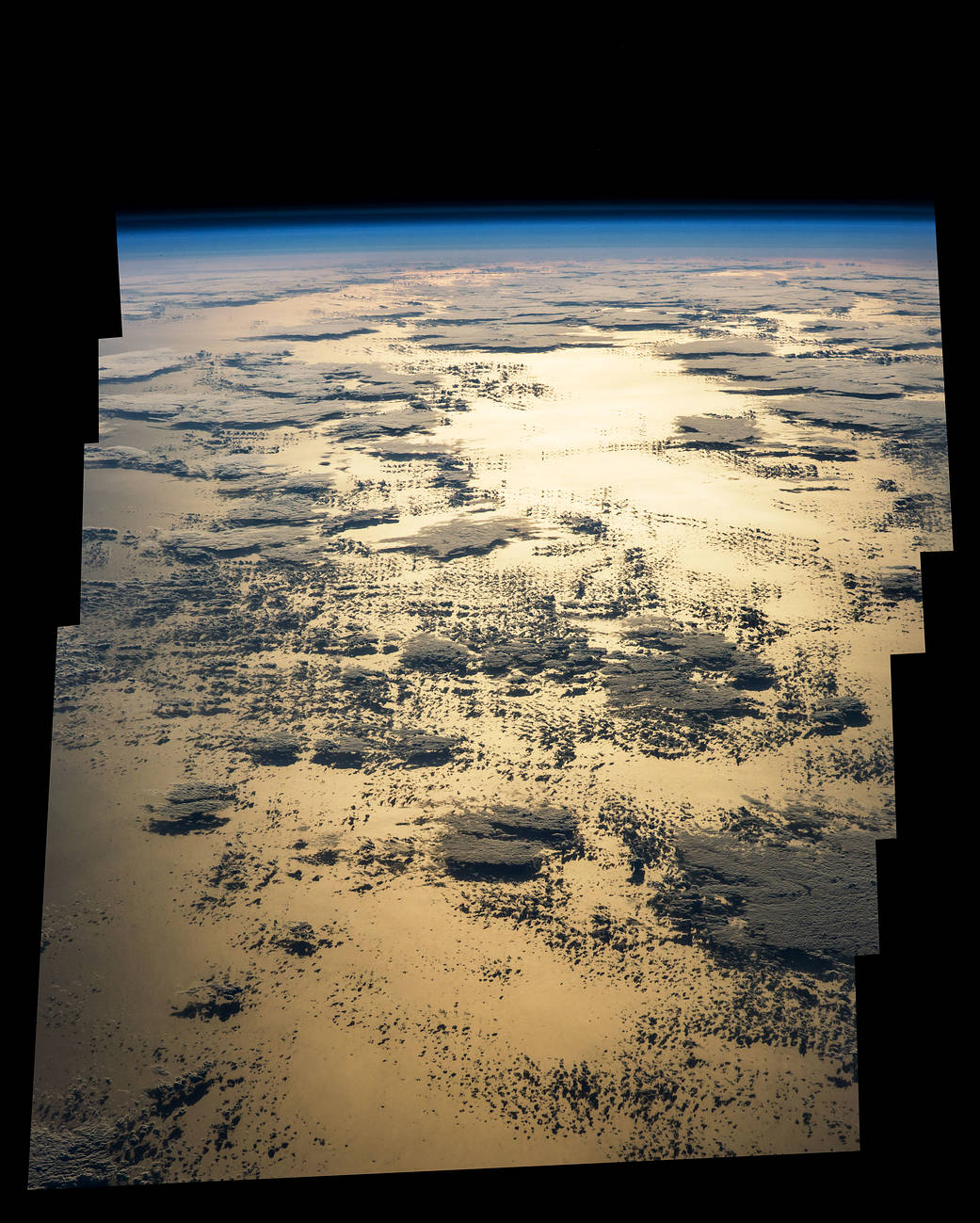 Sunglint and clouds over the ocean photographed from low Earth orbit