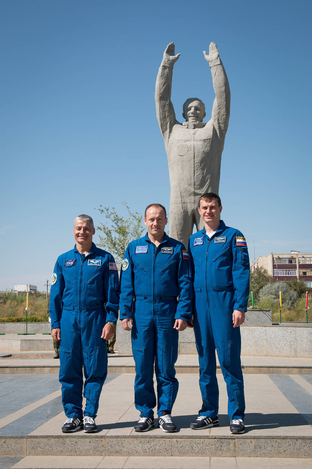 The Expedition 49 backup crewmembers pose for pictures Sept. 10 in front of a statue of Yuri Gagarin.