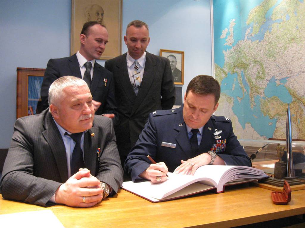 NASA Astronaut Jack Fischer Signs a Commemorative Book