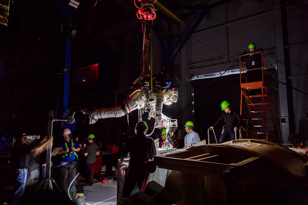 Canadian Space Agency astronaut Jeremy Hansen is suspended over a mock-up of the International Space Station during a microgravi