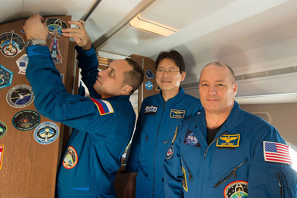 The Expedition 54-55 Crew Aboard a Russian Aircraft