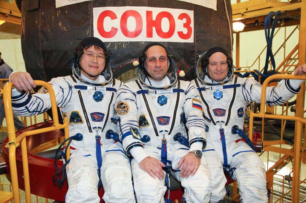 Expedition 54-55 Crew Members in Front of Their Soyuz MS-07 Spacecraft