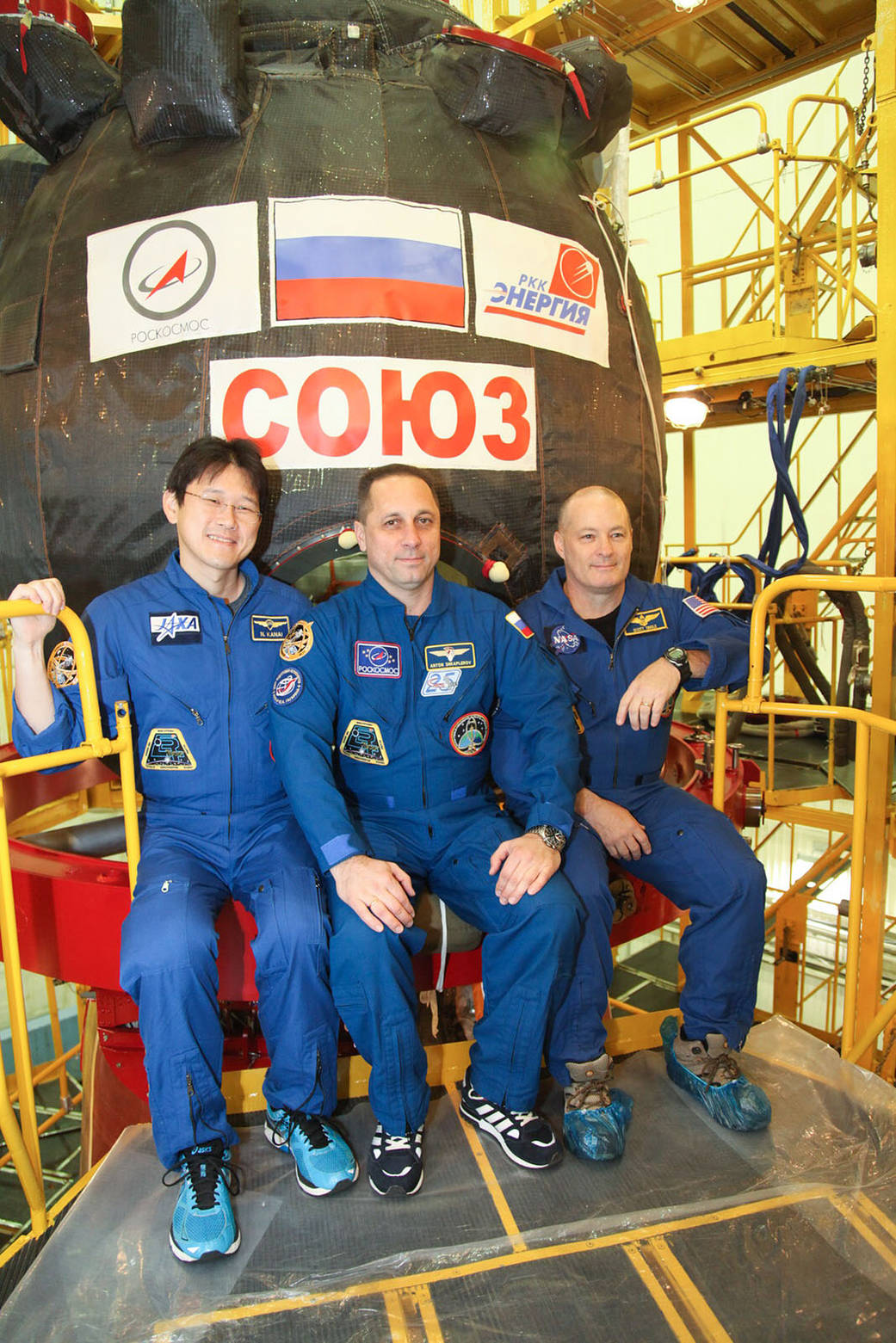 Expedition 54-55 Crew Members in Front of Their Soyuz MS-07 Spacecraft