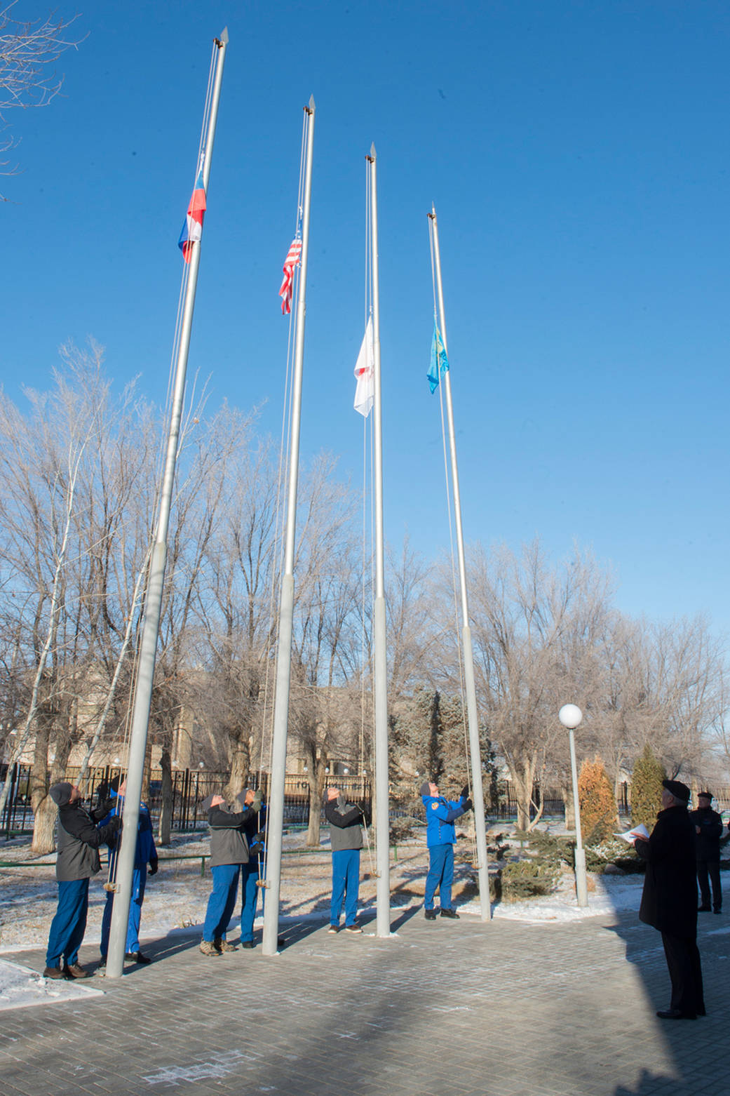  Expedition 54-55 Prime and Backup Crew Members Raise Flags