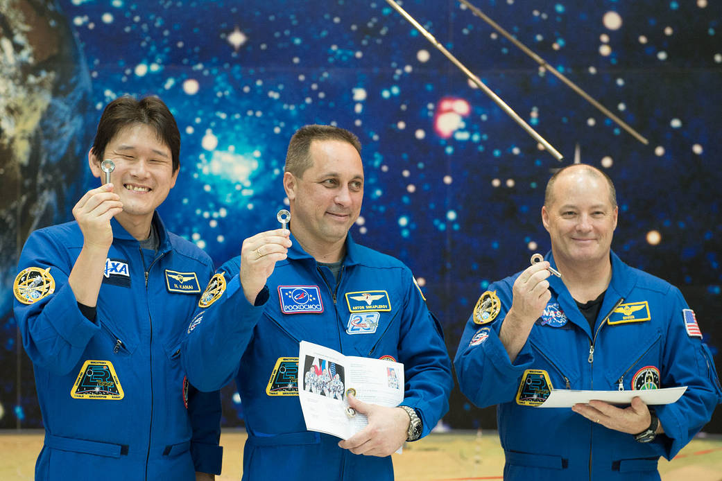 Expedition 54-55 Crew Displays Souvenir Launch Keys