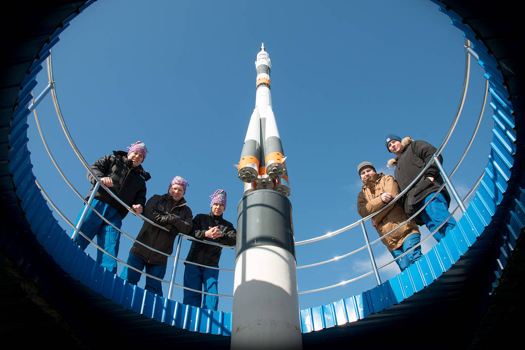Expedition 55 Prime and Backup Crew Pose in Front of Soyuz Model