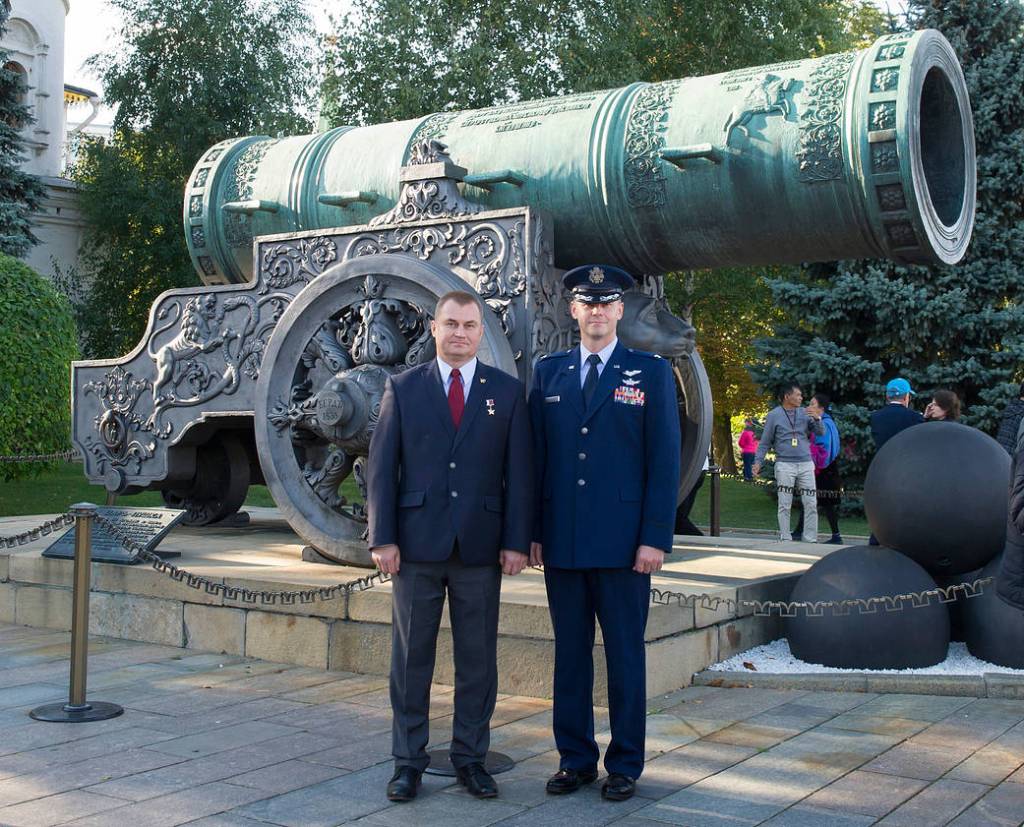 Expedition 57 crew members Alexey Ovchinin and Nick Hague pose in front of the Tsar Cannon