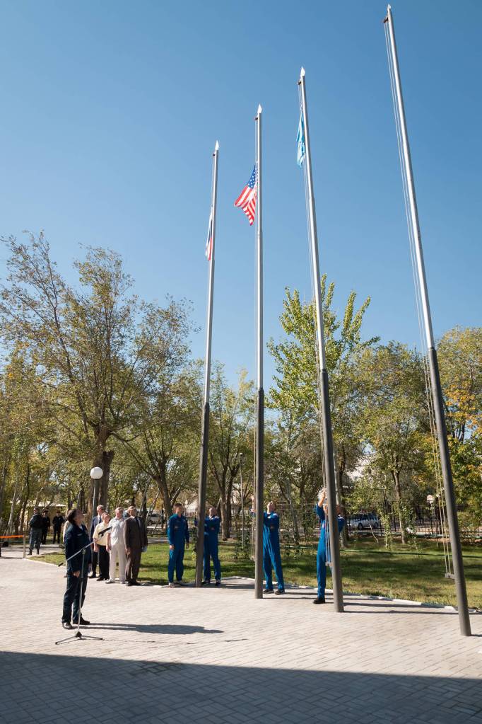 Expedition 57 prime and backup crews during flag raising ceremonies