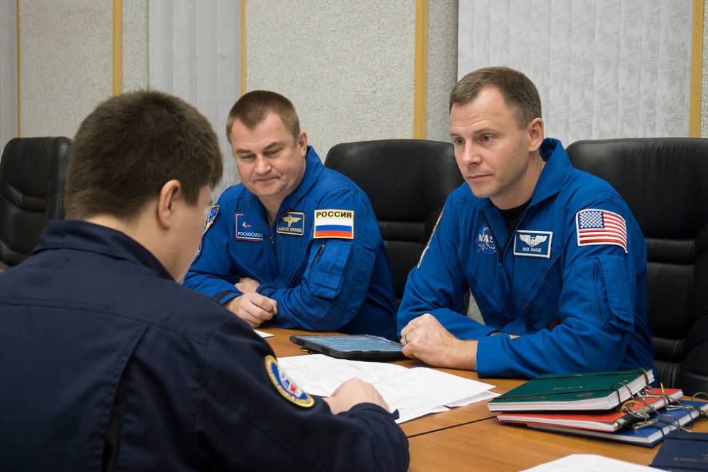 Expedition 57 crew members review training documents