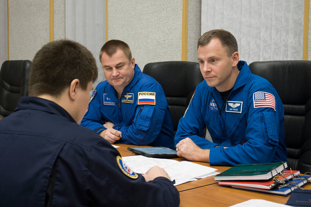 Expedition 57 crew members review training documents